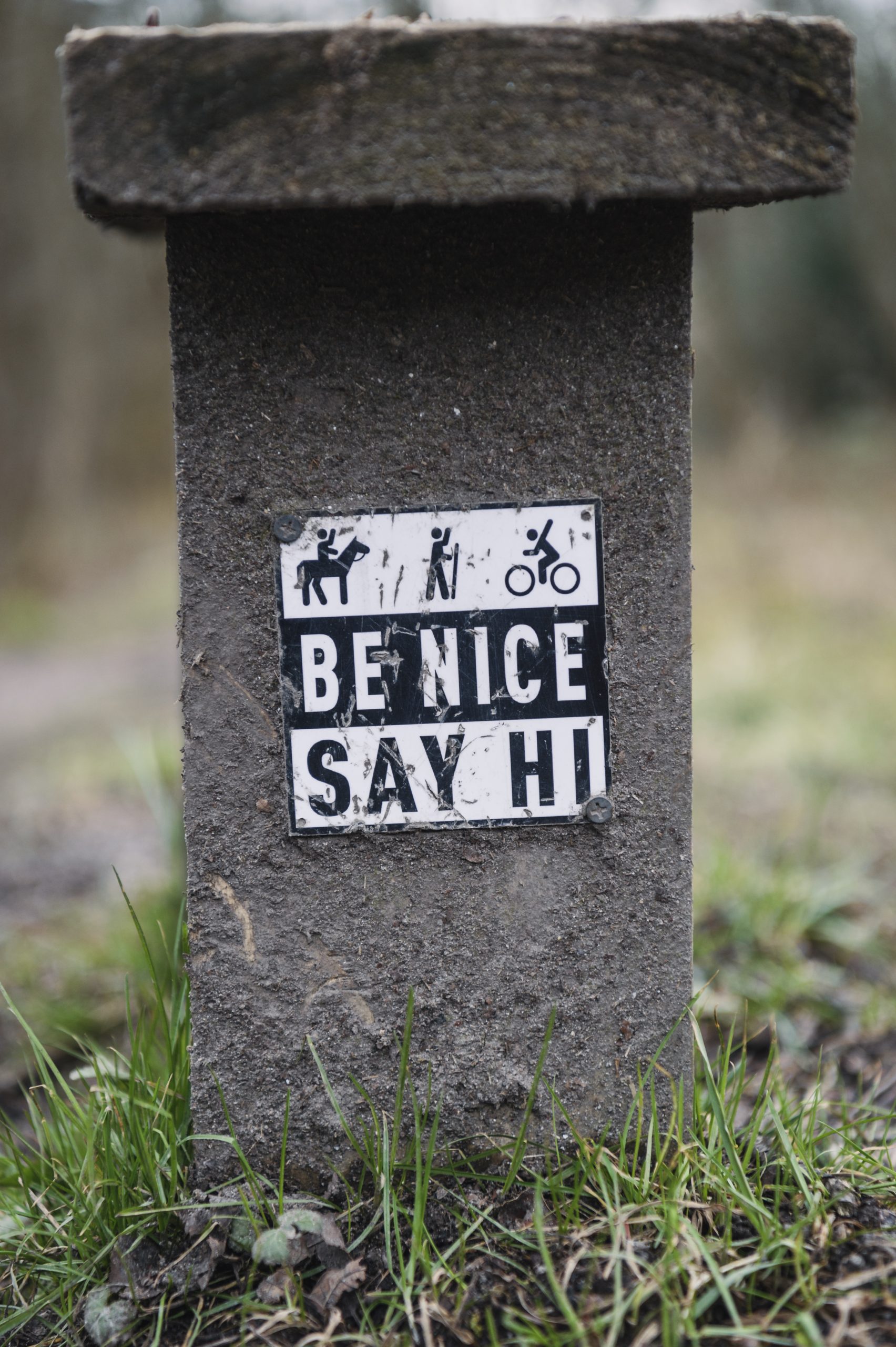 Be Nice Say Hi Sign on the trail